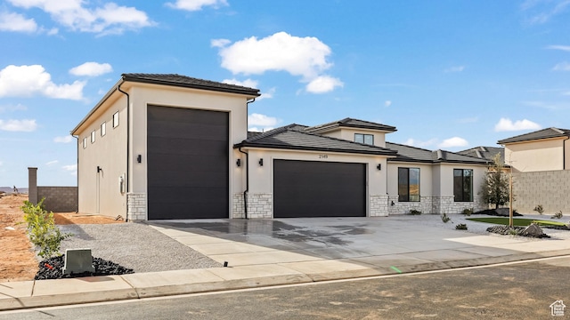 prairie-style home featuring a garage