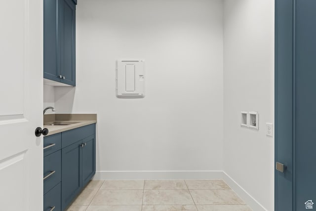 2149 W 3930 S, Hurricane, UT 84737 - clothes washing area featuring washer hookup, cabinet space, baseboards, and light tile patterned floors