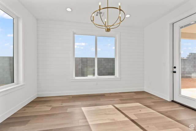 2149 W 3930 S, Hurricane, UT 84737 - unfurnished dining area with a chandelier, baseboards, light wood finished floors, and recessed lighting