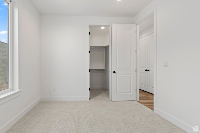 2149 W 3930 S, Hurricane, UT 84737 - unfurnished bedroom featuring light carpet, baseboards, a spacious closet, a closet, and recessed lighting