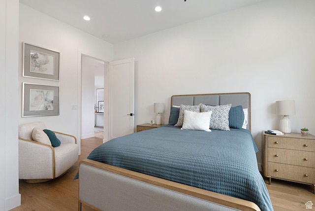bedroom with light hardwood / wood-style floors