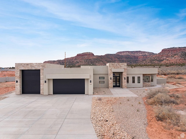 southwest-style home with a mountain view and a garage