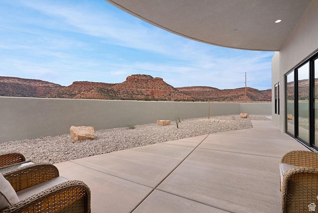 view of patio with a mountain view
