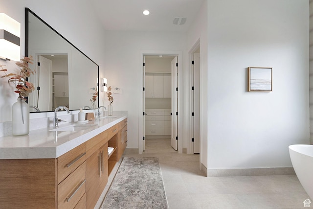 bathroom with a bathing tub and vanity