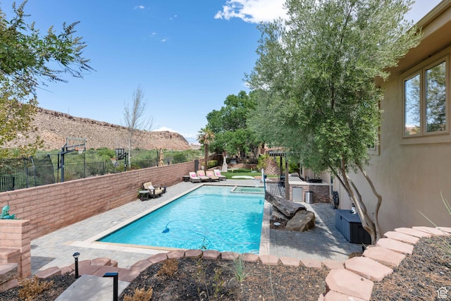 2712 S Rio Vista Dr, St George, UT 84790 - view of pool with an outdoor kitchen and a mountain view