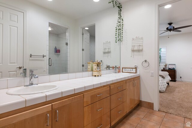 2712 S Rio Vista Dr, St George, UT 84790 - bathroom with tile patterned flooring, vanity, ceiling fan, and walk in shower