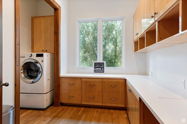 2712 S Rio Vista Dr, St George, UT 84790 - washroom featuring washer / clothes dryer, cabinets, and light hardwood / wood-style floors