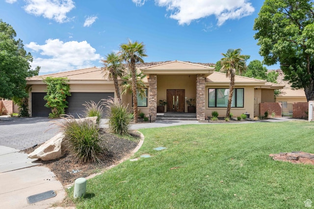 2712 S Rio Vista Dr, St George, UT 84790 - view of front of home with a front lawn and a garage