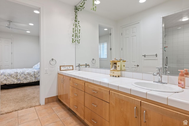 2712 S Rio Vista Dr, St George, UT 84790 - bathroom with tile patterned floors, vanity, ceiling fan, and walk in shower