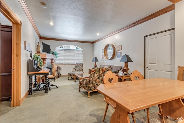dining area with light colored carpet, a textured ceiling, and ornamental molding