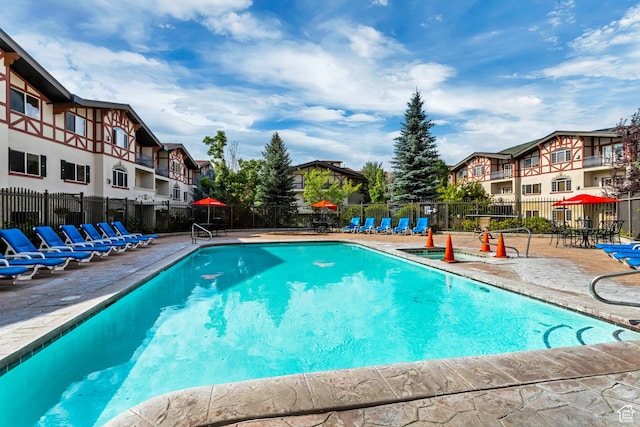 view of pool featuring a patio area