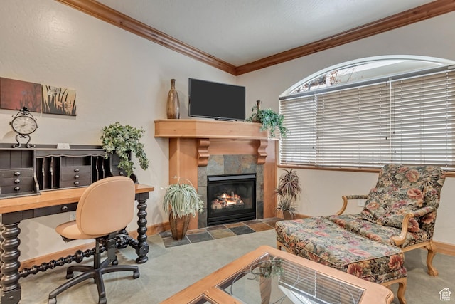 carpeted office with a tile fireplace, crown molding, and vaulted ceiling