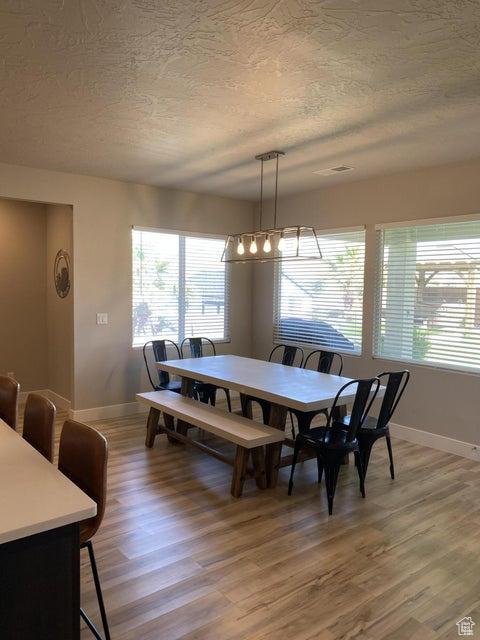 dining room with hardwood / wood-style flooring
