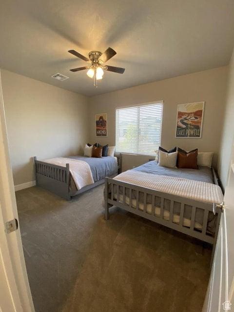 carpeted bedroom with ceiling fan