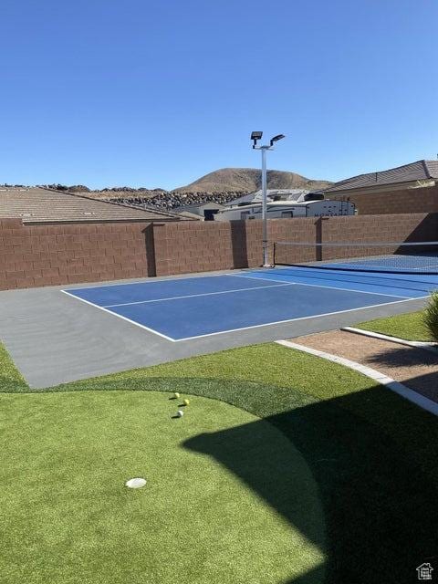 exterior space with a mountain view and basketball court