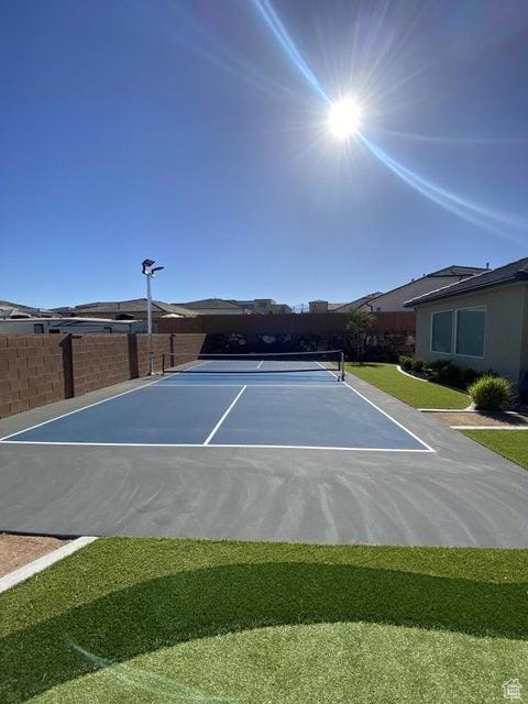 view of sport court with basketball hoop