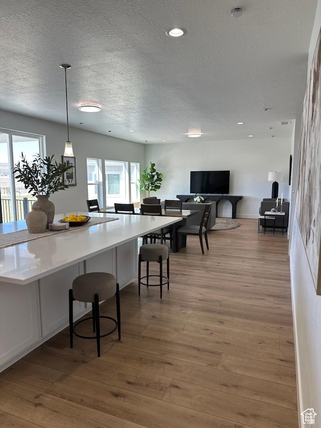 7949 N Bristlecone Rd Unit 206, Eagle Mountain, UT 84005 - dining area with recessed lighting, wood finished floors, and a textured ceiling
