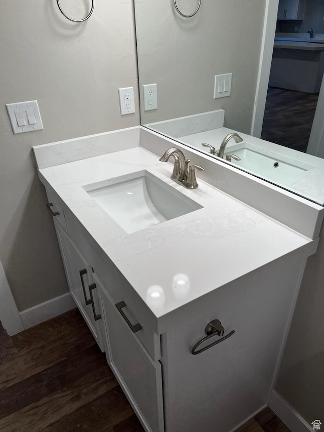 bathroom featuring hardwood / wood-style floors and vanity