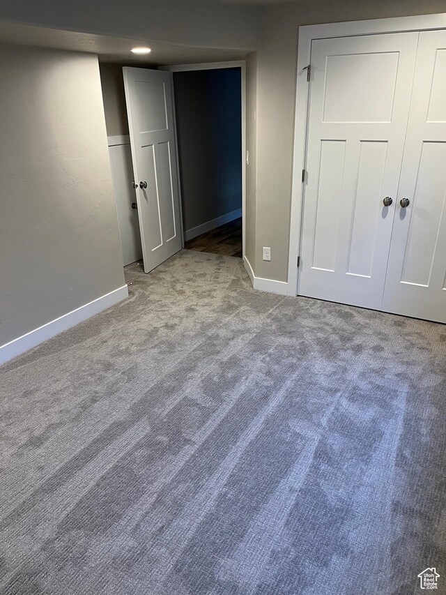 unfurnished bedroom with light colored carpet
