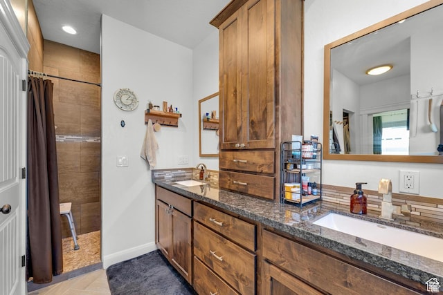 bathroom with vanity, a shower with curtain, and backsplash