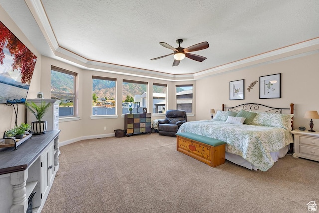 bedroom with ceiling fan, crown molding, light carpet, and multiple windows