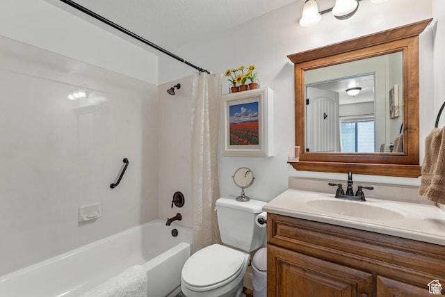 full bathroom featuring vanity, shower / bathtub combination with curtain, and toilet
