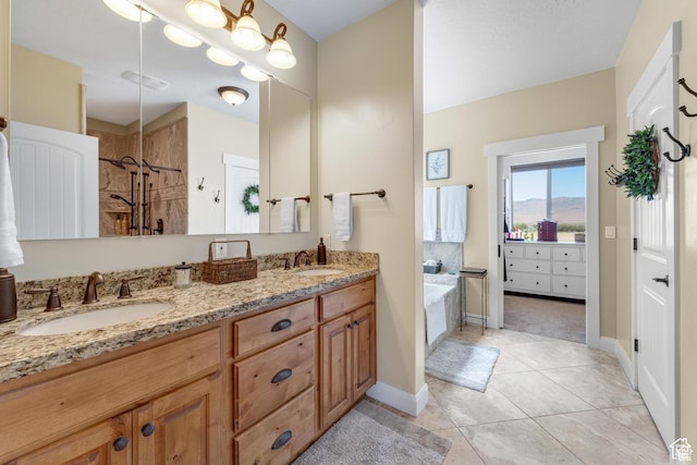 bathroom with tile patterned flooring, shower with separate bathtub, and vanity