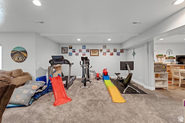 exercise room featuring carpet