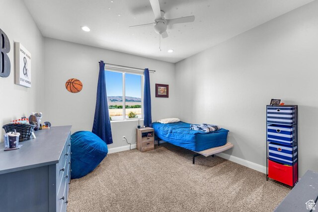 carpeted bedroom featuring ceiling fan
