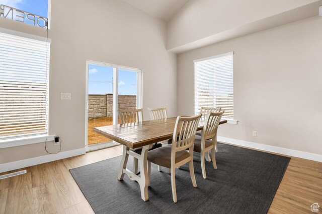 525 N 1550 W Unit Ge01, Mapleton, UT 84664 - dining space with visible vents, a high ceiling, baseboards, and wood finished floors