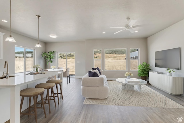 5401 N Orville St Unit 426, Eagle Mountain, UT 84005 - living room featuring a ceiling fan, recessed lighting, wood finished floors, and baseboards