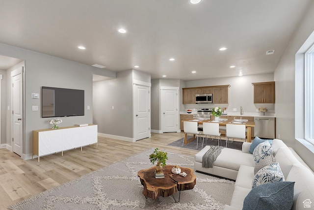 5401 N Orville St Unit 426, Eagle Mountain, UT 84005 - living area featuring visible vents, recessed lighting, baseboards, and light wood-style floors