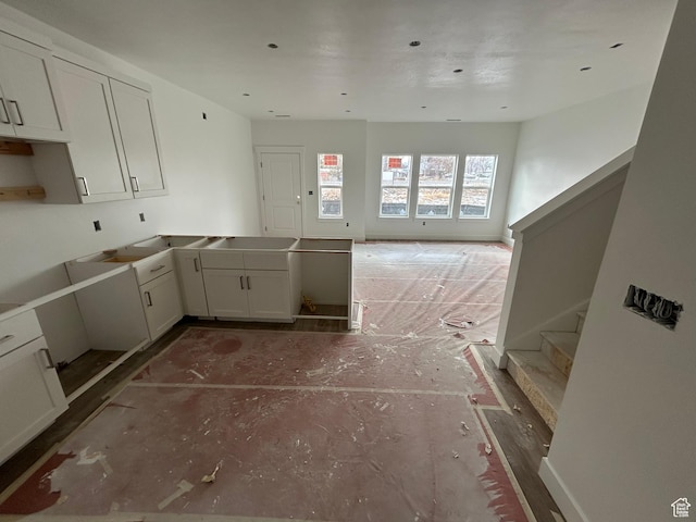 206 W 3175 S Unit T610, Nibley, UT 84321 - kitchen featuring white cabinets and a peninsula