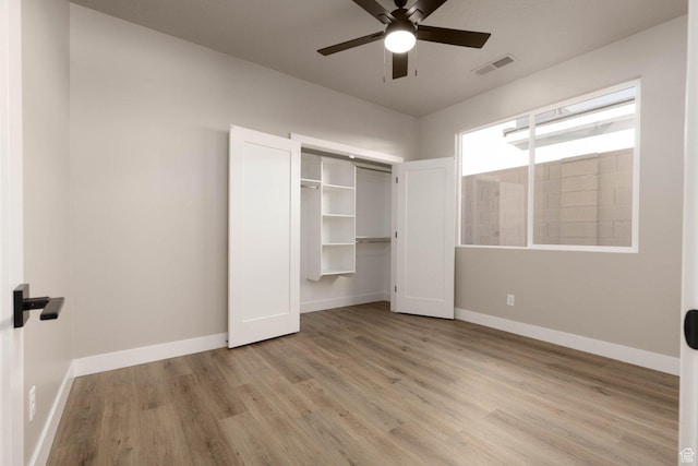 2227 W 320 S, Hurricane, UT 84737 - unfurnished bedroom with ceiling fan, a closet, and light wood-type flooring