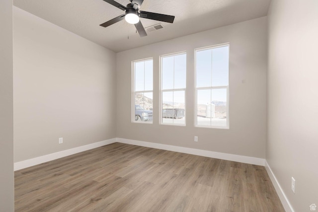 2227 W 320 S, Hurricane, UT 84737 - spare room with ceiling fan, light hardwood / wood-style flooring, and a textured ceiling