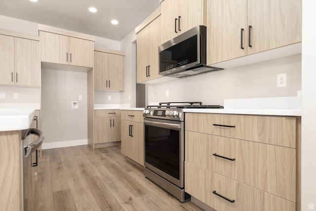 2227 W 320 S, Hurricane, UT 84737 - kitchen with light brown cabinets, light hardwood / wood-style flooring, and appliances with stainless steel finishes