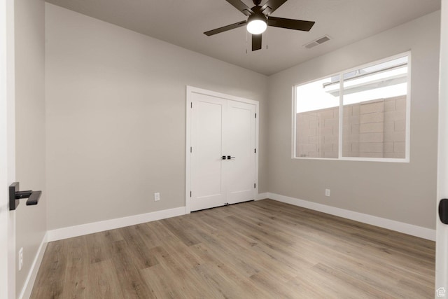 2227 W 320 S, Hurricane, UT 84737 - unfurnished bedroom with a closet, light hardwood / wood-style flooring, and ceiling fan