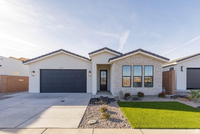 2227 W 320 S, Hurricane, UT 84737 - view of front facade with a garage and a front lawn