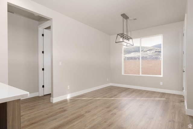 2227 W 320 S, Hurricane, UT 84737 - unfurnished dining area with hardwood / wood-style floors