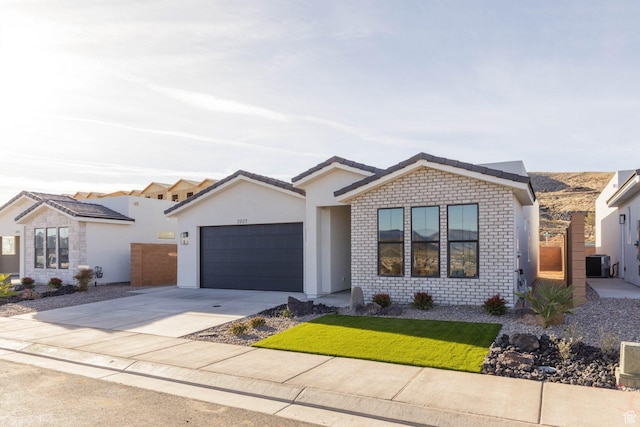 2227 W 320 S, Hurricane, UT 84737 - view of front of home with a garage and central air condition unit