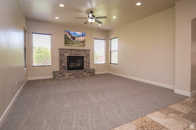 2596 S Little Valley Rd, St George, UT 84790 - unfurnished living room with a fireplace, light colored carpet, and ceiling fan