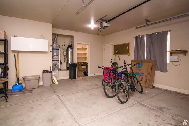 2596 S Little Valley Rd, St George, UT 84790 - garage featuring a garage door opener and water heater