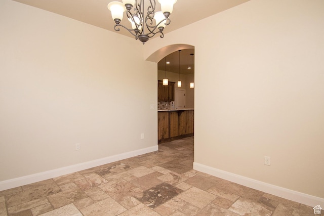 2596 S Little Valley Rd, St George, UT 84790 - empty room featuring a notable chandelier