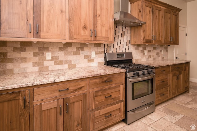 2596 S Little Valley Rd, St George, UT 84790 - kitchen featuring gas stove, decorative backsplash, light stone countertops, and wall chimney exhaust hood
