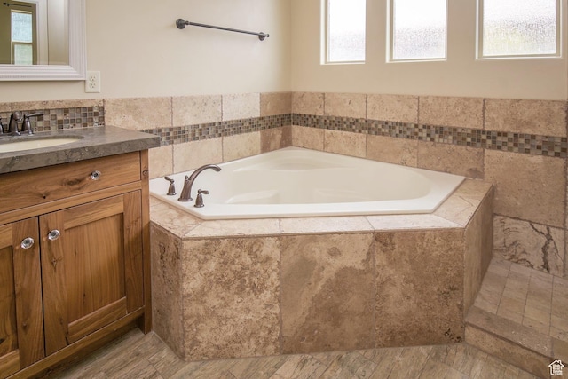 2596 S Little Valley Rd, St George, UT 84790 - bathroom featuring vanity, plenty of natural light, and tiled tub
