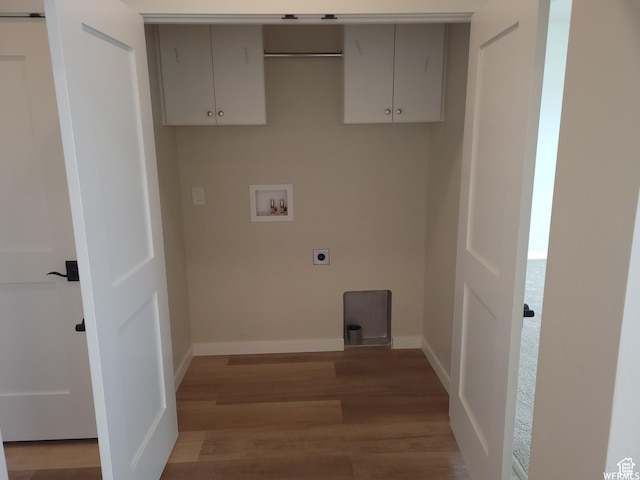 laundry area with hookup for an electric dryer, light hardwood / wood-style floors, cabinets, and hookup for a washing machine