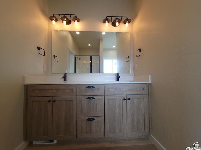 bathroom featuring vanity and walk in shower