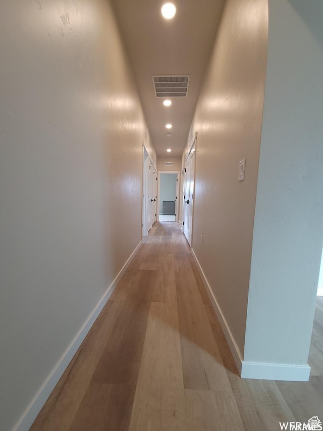 corridor featuring light hardwood / wood-style floors
