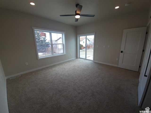 unfurnished room featuring ceiling fan and light colored carpet