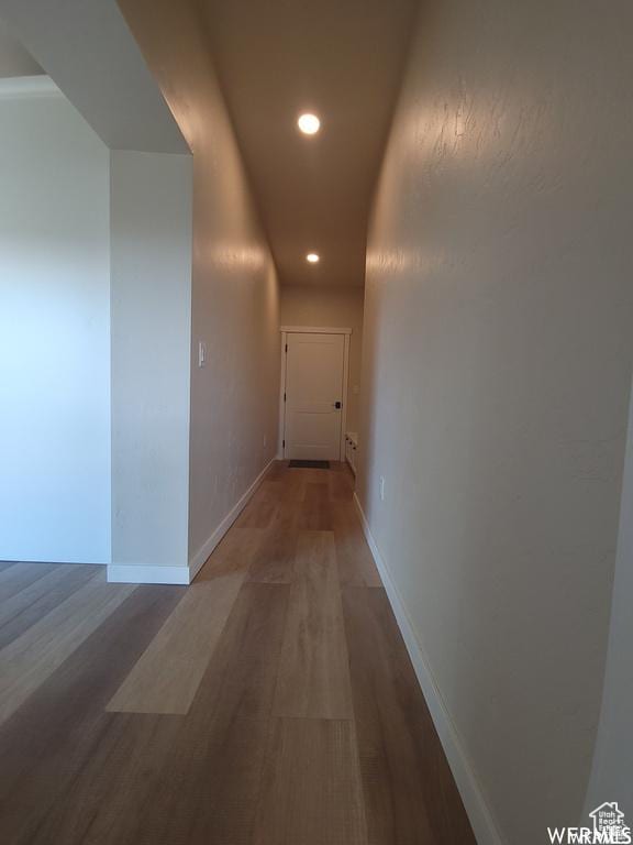 corridor featuring hardwood / wood-style floors